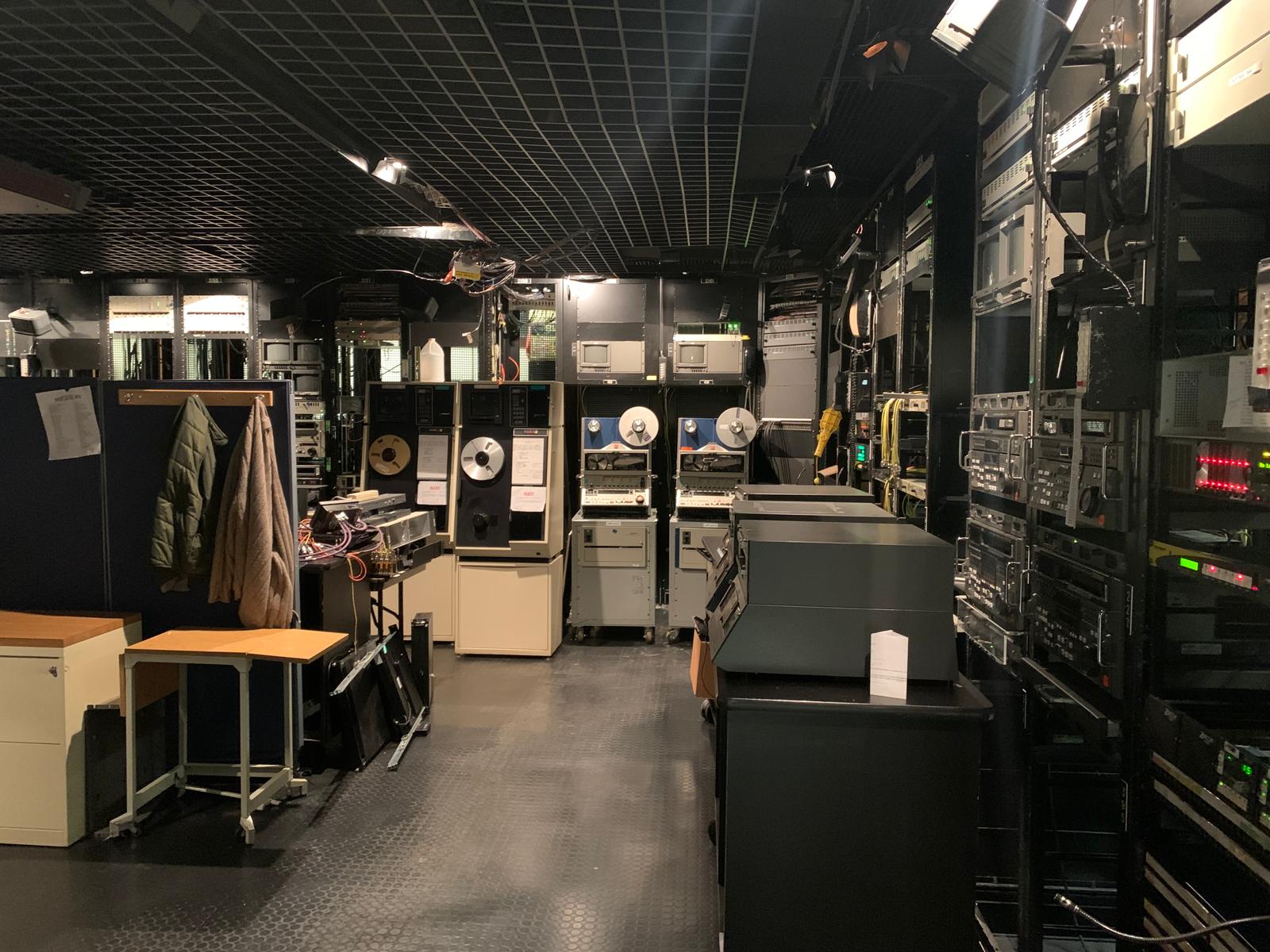 Equipment room at CBS Studios with racks of legacy and modern broadcast hardware.