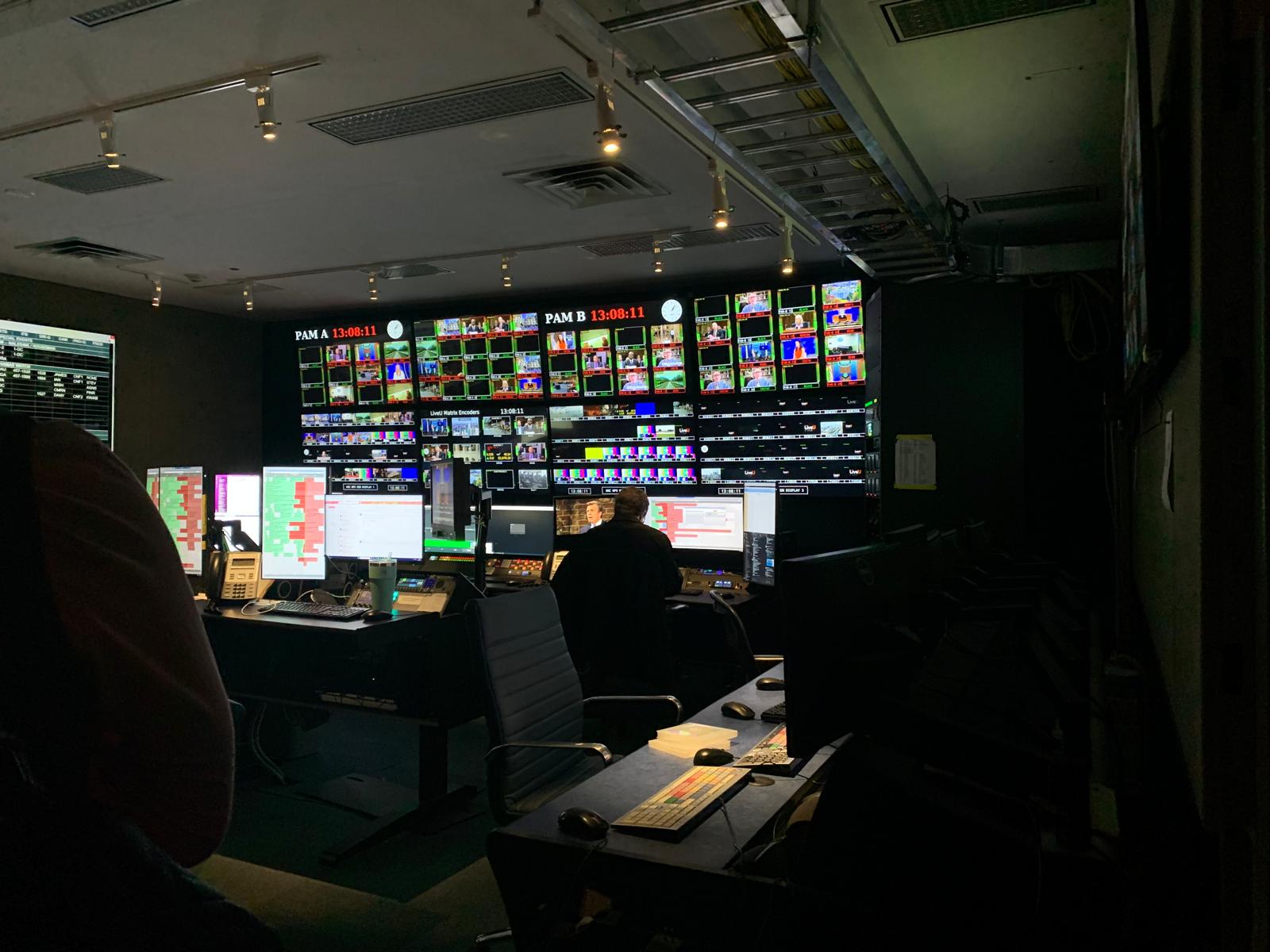 CBS master control room with operators monitoring many live channels at once.